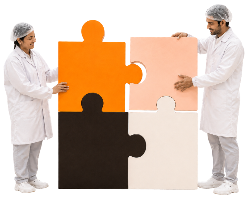 Swara Baby employees in clean-room uniforms fitting jigsaw pieces together, illustrating the Customer First core value
