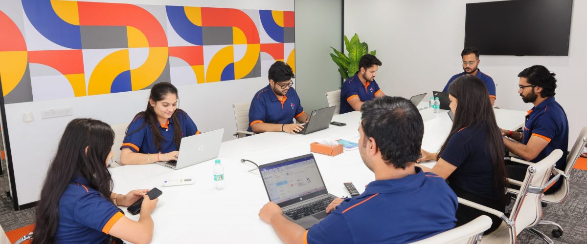 Swara Baby Group team in a meeting around the boardroom table
